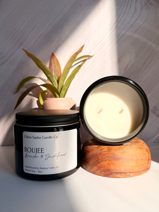 Lavender and sandalwood hand poured natural soy candle. Boujee is pure luxury captured in a jar, this fragrance is stunning, lavish beauty in every whiff. Notes of lavender & sandalwood. Pearlized white shimmer upon melting.
