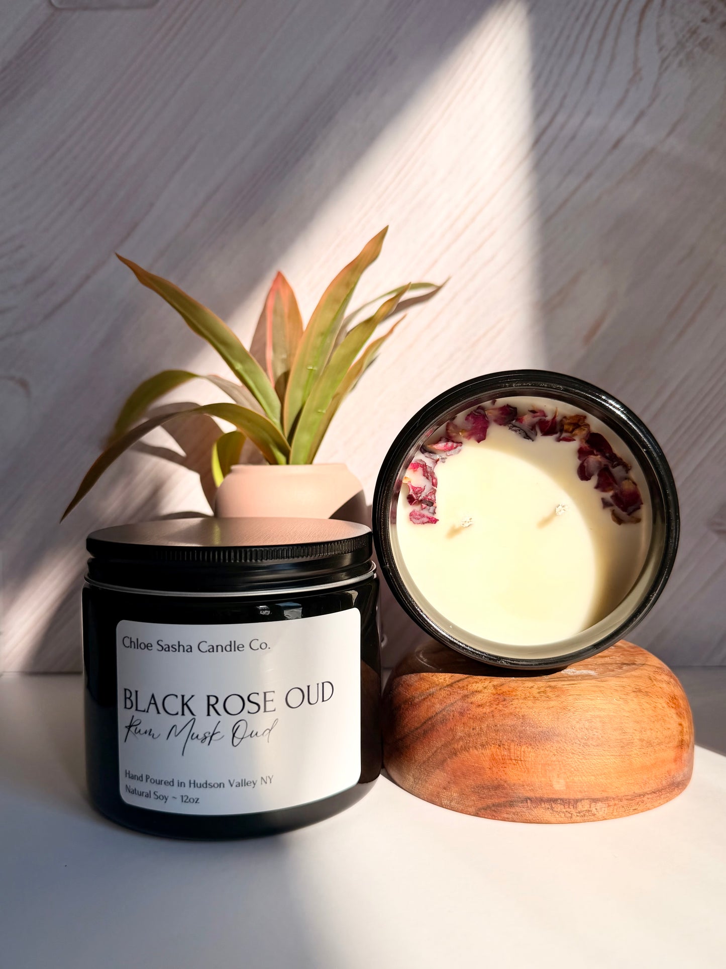 Black Rose Oud hand poured natural soy candle. An intoxicating woody embrace opens with lush amaretto and a whisper of soft powder—modern, effortless everyday luxury. I call it “Date Night” in a jar! Notes of rum, musk & oud. Pearlized white shimmer upon melting.