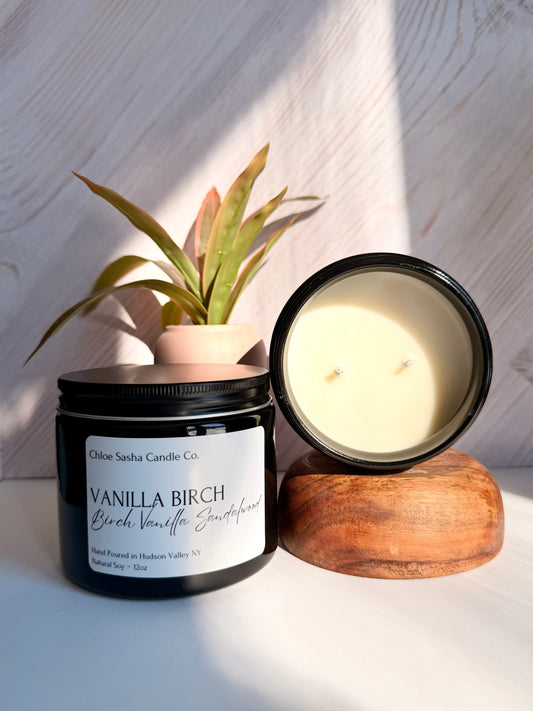 Vanilla Birch hand poured natural soy candle. Radiating quiet luxury, this sophisticated scent layers the bright purity of white birch atop the lush, gourmand allure of Madagascar vanilla, finished with the timeless elegance of warm sandalwood. Notes of birch, vanilla & sandalwood. Pearlized white shimmer upon melting.